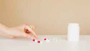a hand grabbing unused medications